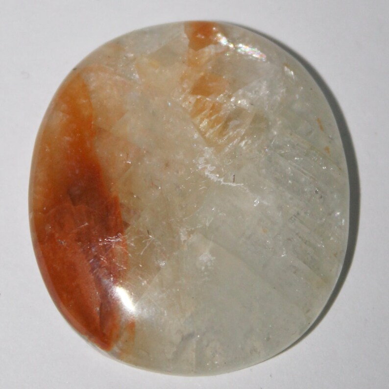 Orange calcite cabochon 36x32x4 mm