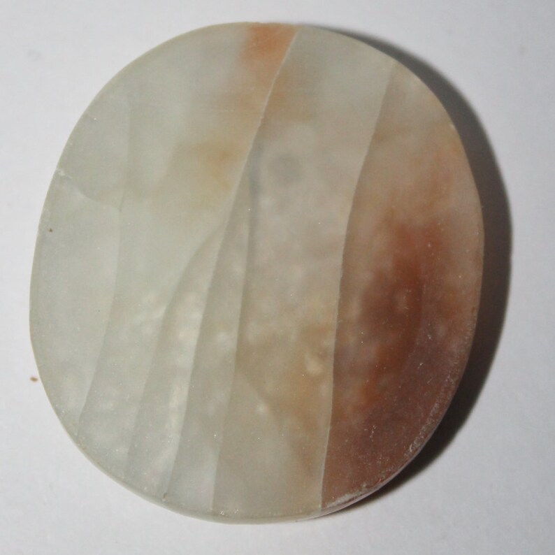 Orange calcite cabochon 36x32x4 mm