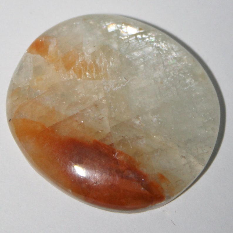 Orange calcite cabochon 36x32x4 mm