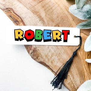 Bookmark with name in red, yellow, blue and green colors.