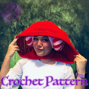 May include: A red crochet hooded hat with pink and white striped ear flaps. The hat is made with a single crochet stitch and has a simple design.