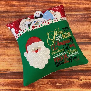 K&ouml;nnte beinhalten: Ein Weihnachtsstrumpf mit gr&uuml;nem K&ouml;rper und rotem Oberteil. Der Strumpf zeigt einen gestickten Weihnachtsmann und den Text "Twas the night before Christmas". Das Oberteil ist mit Weihnachtsm&auml;nnern und Schneeflocken gemustert.