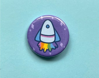 Rainbow Rocket Pinback Buttons - Cute 1.25” Purple Pinback Button Badges with a Rocket Launching Rainbow Flames