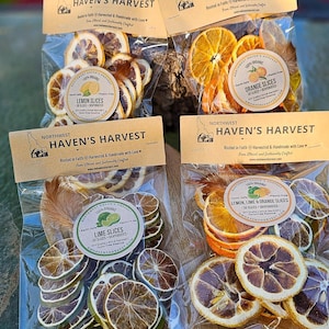 May include: Four clear plastic pouches of dehydrated fruit slices labeled Northwest Haven's Harvest. The bags contain lemon slices, orange slices, lime slices, and a mix of lemon, lime, and orange slices, each with a round product sticker.