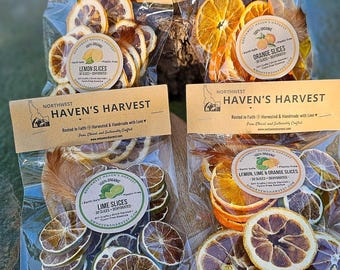 May include: Four clear plastic pouches of dehydrated fruit slices labeled Northwest Haven's Harvest. The bags contain lemon slices, orange slices, lime slices, and a mix of lemon, lime, and orange slices, each with a round product sticker.