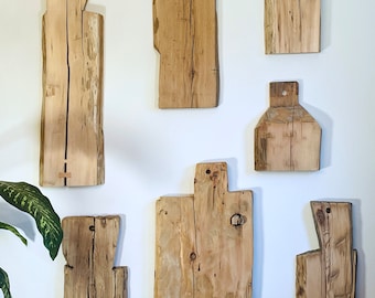 Naked wood wall hangings made from Pioneer log cabins