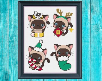 May include: Four cross-stitch patterns featuring Siamese cats dressed in festive holiday attire. The cats are wearing a Santa hat, a reindeer headband, a bow, and a stocking.