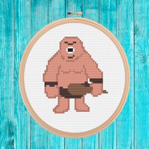 May include: Cross stitch pattern of a pink, pixelated, muscular, humanoid figure with a brown loincloth and a club. The figure has a large, white eye and a wide, open mouth.