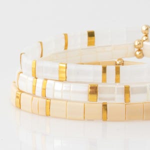 May include: A rustic wooden sign with the text "Welcome to our porch" in white lettering. The sign features a distressed finish and a simple, inviting design, perfect for outdoor decor.