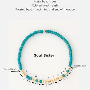 May include: A turquoise beaded bracelet spelling "Soul Sister" in Morse code. The bracelet features gold-colored beads for the letters and turquoise beads for the surrounding design. The image includes instructions on how to read the Morse code.