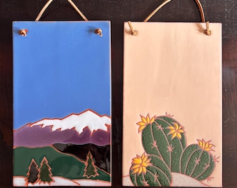 Set of 2 handmade ceramic tiles with leather hangings cactus and mountain theme