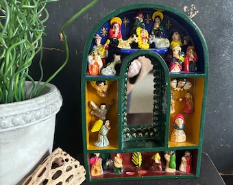 Vintage Peruvian retablo box with hand painted nativity angels saints in arched shadowbox made in Peru hand painted and made global decor