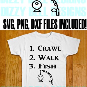 May include: A white t-shirt with black text that reads "1. Crawl 2. Walk 3. Fish" and a black illustration of a fishing hook with a fish on the line.