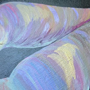 May include: An abstract painting on canvas featuring two large, leaf-like shapes against a solid black background. The shapes are filled with blended brushstrokes of iridescent purple, soft pink, pale yellow, and light blue paint with visible texture.