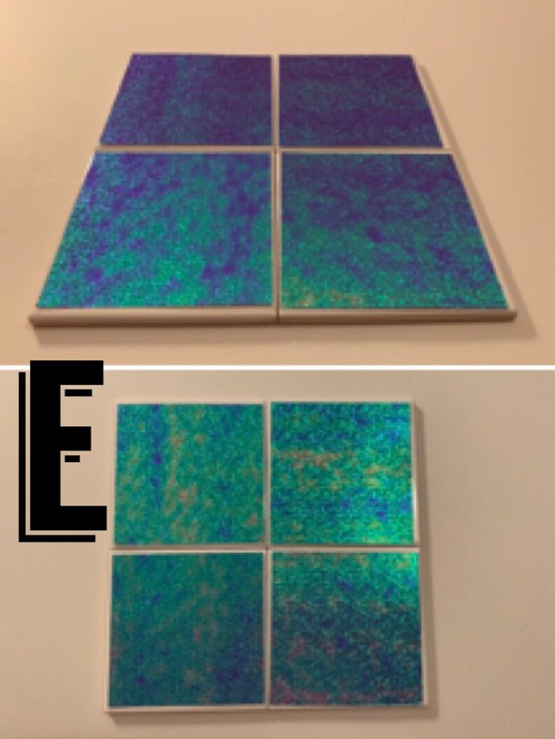 May include: Set of four iridescent blue and green square tiles. The tiles are arranged in a 2x2 grid.
