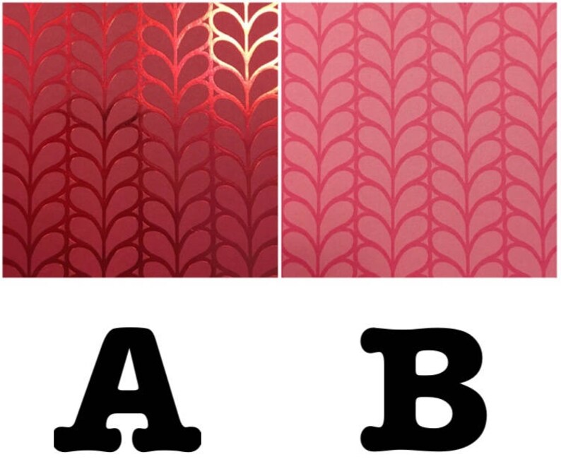 May include: Two samples of fabric with a repeating pattern of stylized leaves. The fabric on the left is a deep red with a metallic sheen. The fabric on the right is a light pink.