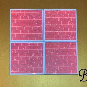 May include: Set of four square coasters with a brick pattern and white speckles. The coasters are pink and have a white border.