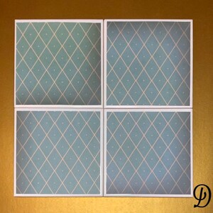 May include: Four square ceramic tiles with a light blue background and a white diamond pattern. The tiles have a white border.