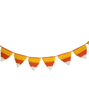 May include: A crocheted garland featuring candy corn-shaped pennants. Each pennant has a white tip, a yellow center, and an orange base. The garland is strung on a thin, tan cord, perfect for Halloween or fall decor.