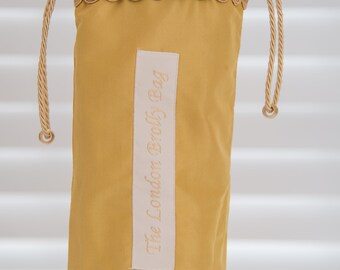 Brolly bag/  umbrella holder. Pretty Gold satin with gold braid trim with waterproof lining/wet brolly bag/ brolly dry bag/ gift for her