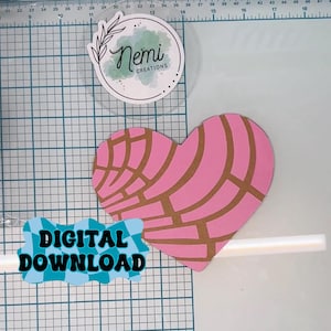 May include: Digital download of a pink heart-shaped pastry with a brown grid pattern. The text "DIGITAL DOWNLOAD" is in blue and white checkered font.