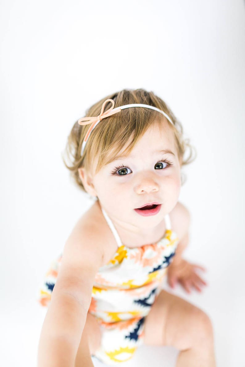 Faux suede bow on nylon headband a sweet and simple baby girls bow