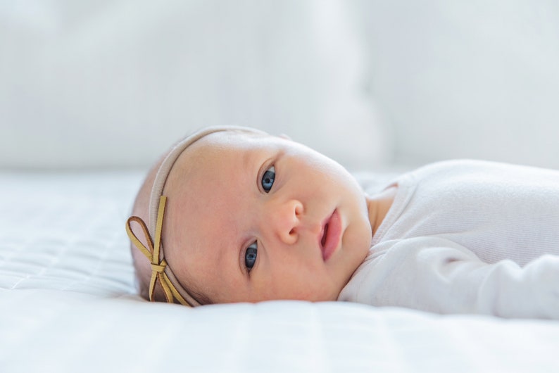 Faux suede bow on nylon headband a sweet and simple baby girls bow