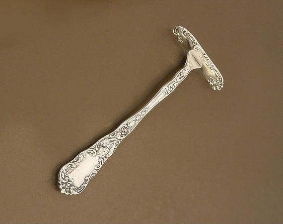 Cupid by Dominick & Haff Sterling Silver Baby Food Pusher