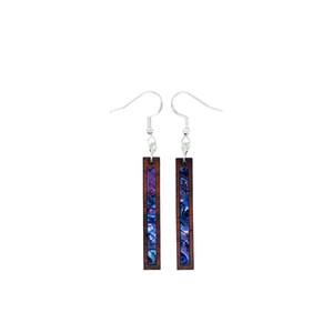 May include: A pair of wooden earrings with a silver hook. The earrings are rectangular and have a blue and purple abalone inlay.