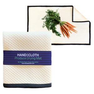 May include: White produce drying mat with black trim and a blue label that reads "HANDECLOTHE Produce Drying Mat No Waste Paper Towel Alternative www.handecloth.com".