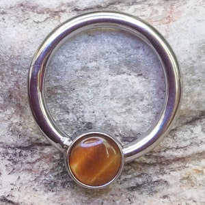 Surgical Steel Belly Button Navel Ring Bar with Tiger's Eye Semi Precious Oval Stone Surgical Steel Belly Button Navel Ring Bar with Tiger's Eye Semi Precious Oval Stone