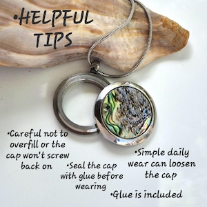 May include: A silver-toned circular locket necklace with an iridescent abalone shell inlay. The locket is open, revealing a hollow interior. Text on the image reads: Helpful Tips, Careful not to overfill, Seal the cap with glue, Glue is included, Simple daily wear can loosen the cap.