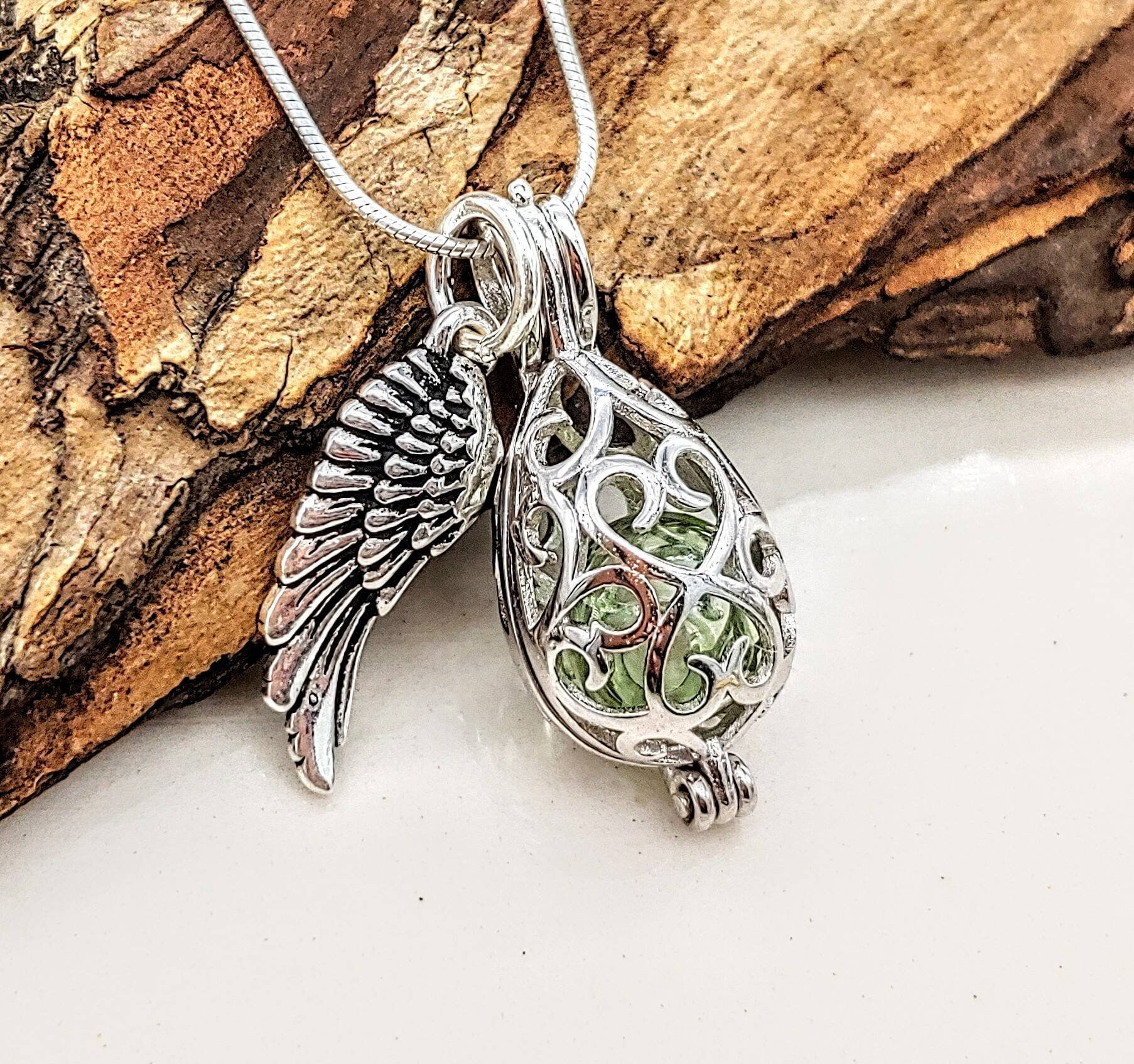 Angel Wings Wrapped Around Clear Colored Stone Cremation Jewelry Necklace Angel Wings Wrapped Around Clear Colored Stone Cremation Jewelry Necklace