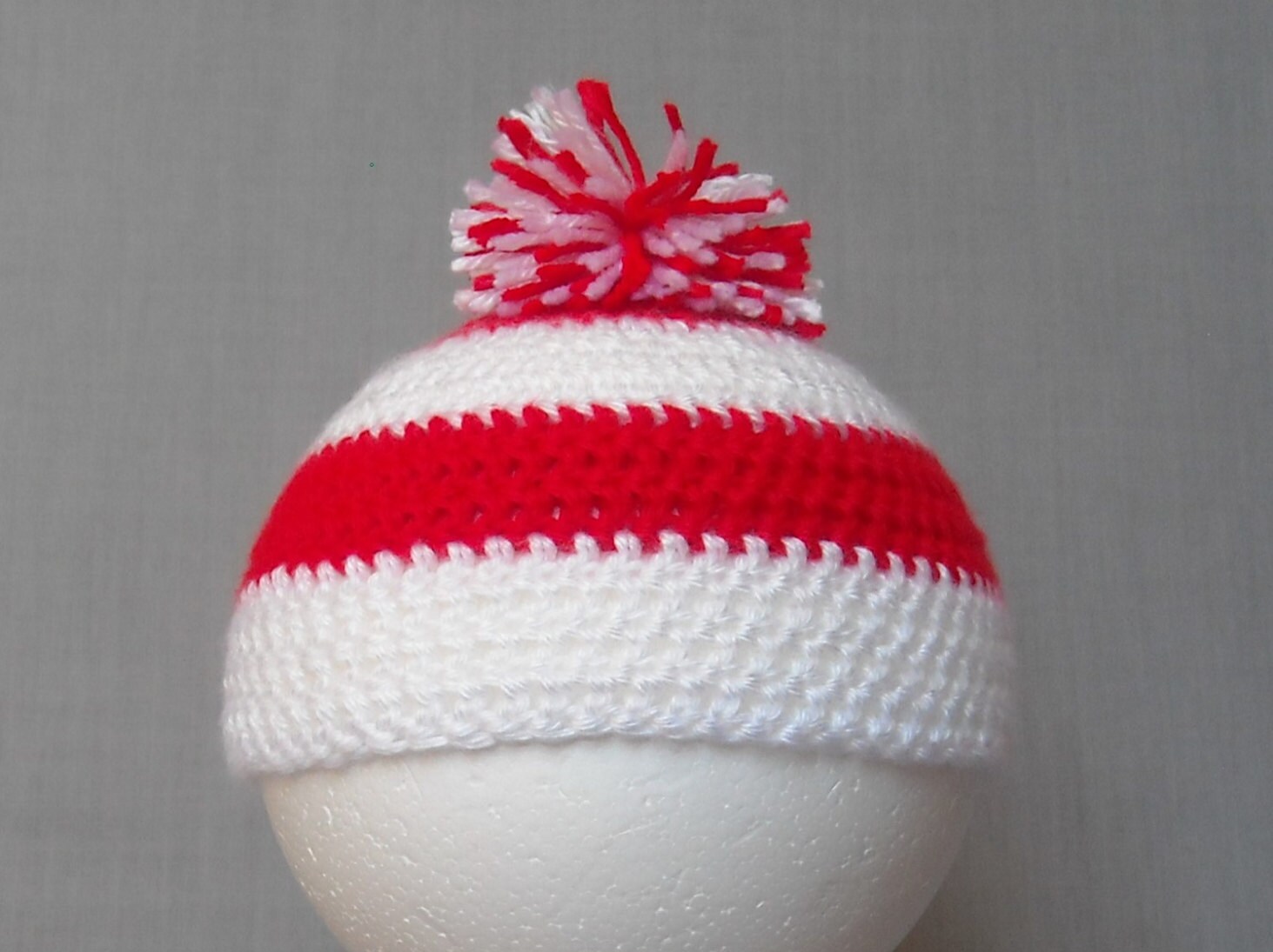 red and white striped beanie with pom pom