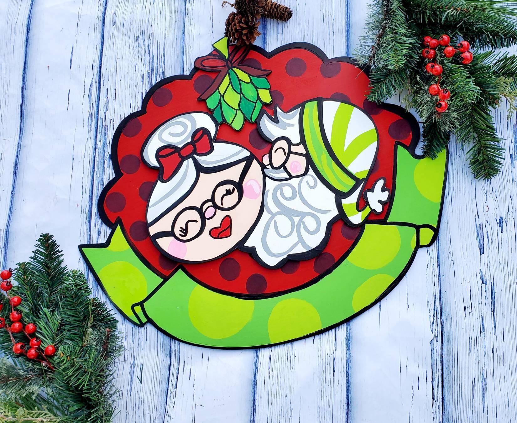 Mr &amp; Mrs Santa Claus Kissing Under Mistletoe. Can be customized with name.