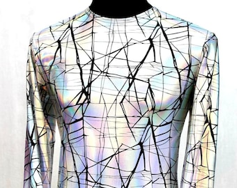 May include: A long-sleeved shirt with a white background and a black geometric pattern. The fabric has a iridescent sheen.