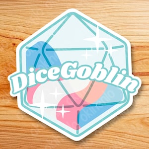 May include: A sticker featuring a stylized D20 die design with the text "Dice Goblin". The die is light blue with pink and blue accents and white starbursts. The sticker has a white border and is set against a wood grain background.