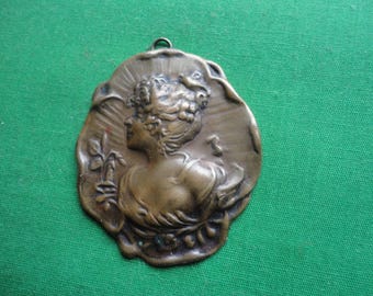 Early 20th Century Pressed Metal Pendant