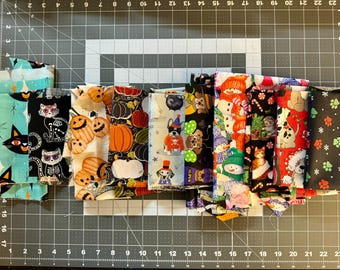 Cotton fabric destash in holiday themes, 15 pieces, various sizes, over 13 oz. of fabric, see pics, Halloween and Christmas fabric