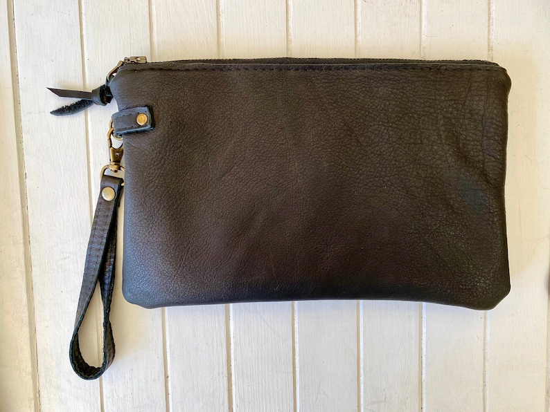 The perfect clutch Black & white cowhide or buttery soft leather wristlet clutch or small crossbody purse. Black