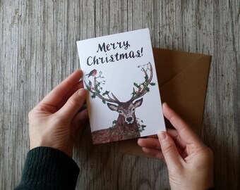 Merry Christmas Deer Christmas Card pack by Alice Draws the Line featuring a stag decked in Holly, Ivy, Mistletoe & a Robin!