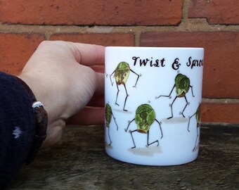 Twist and Sprout!  Mug design with illustrations by Alice Draws The Line; Brussels Sprouts doing the twist on tea/ coffee mug