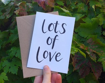 Lots of Love greeting card by Alice Draws The Line featuring hand brush lettering, blank inside and suitable for many occasions, love card