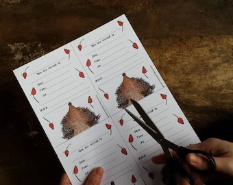 May include: Printable party invitations featuring a hedgehog illustration and red berry accents. The text "You are invited to" is printed on each card.