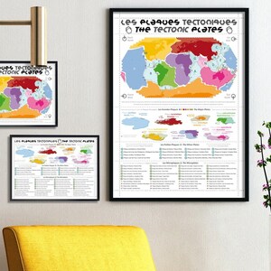 May include: Three framed prints of a colorful map of tectonic plates, with text in French and English. The prints are displayed on a wall above a yellow armchair. The text on the prints reads "Les Plaques Tectoniques / The Tectonic Plates".