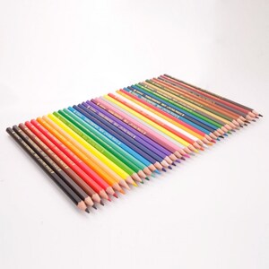 May include: A set of 30 colored pencils with a variety of colors, including red, orange, yellow, green, blue, purple, brown, and black. The pencils are arranged in a row, with the tips of the pencils facing the viewer.
