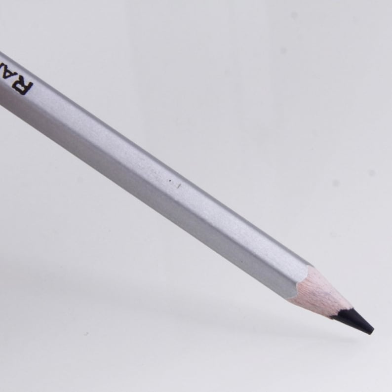 May include: A silver pencil with a black eraser and the word "RA" printed on the side.