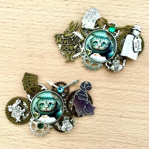 Alice in wonderland brooch, Cheshire Cat or rabbit, with charms and Alice glass cabochon