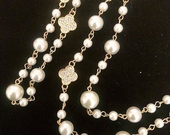 long necklace of rosary beads, white and gold, very long necklace