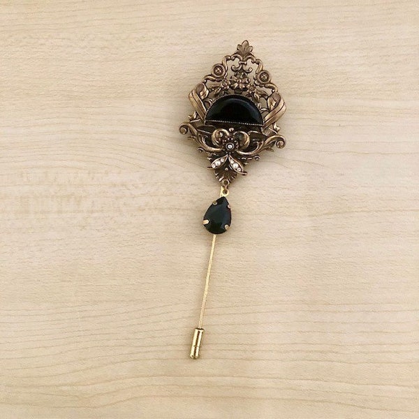 Broche vintage en laiton bronze et cristal noir